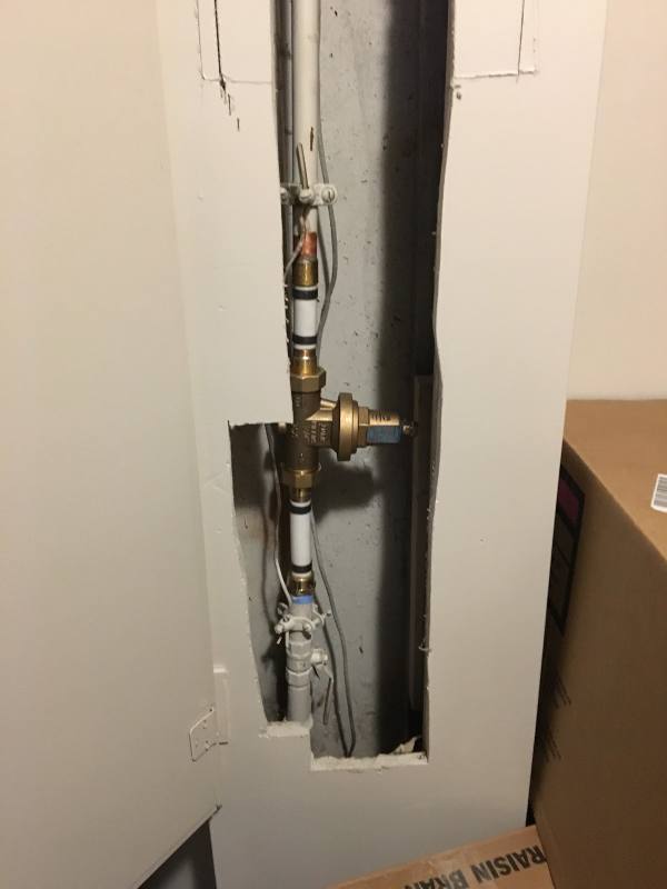 New brass pressure-reducing valve on the main water line